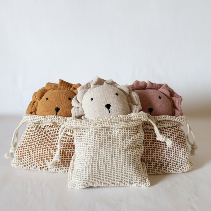 Lion cuddly toy in a cotton wash bag