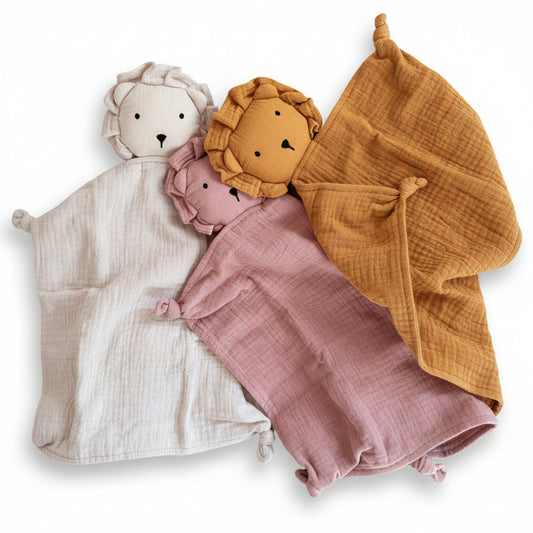 Three muslin lion cuddly toys